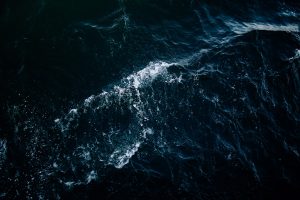 Dramatic stormy ocean scene representing the dark power of Imu in One Piece