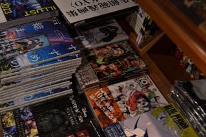 Shonen Jump manga volumes on shelf