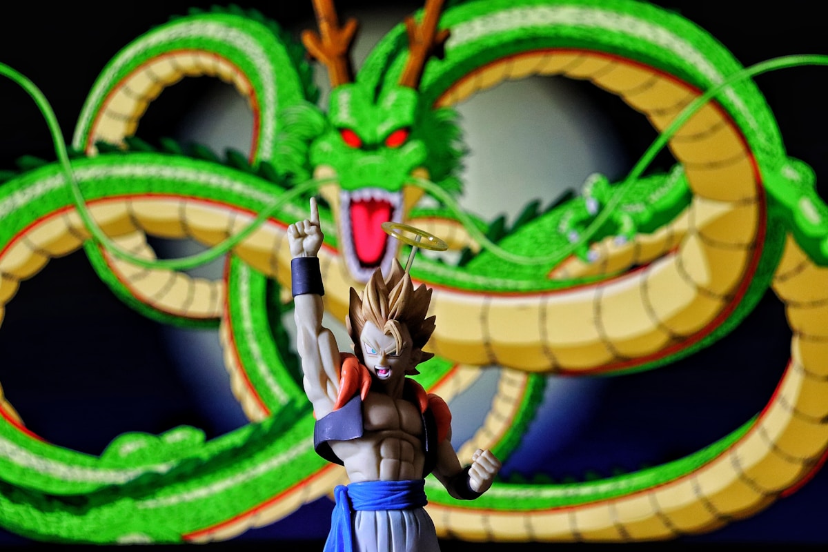Dragon Ball gogeta action figure with Shenron dragon behind it