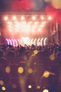 Concert stage performance with crowd and lights